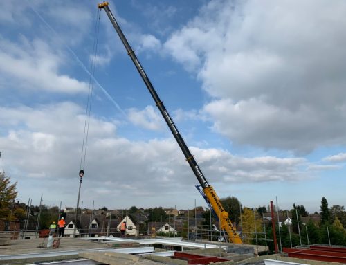 Concrete Floor Slabs And Cranes At New Build Residential Apartment Block In Great Dunmow, Essex